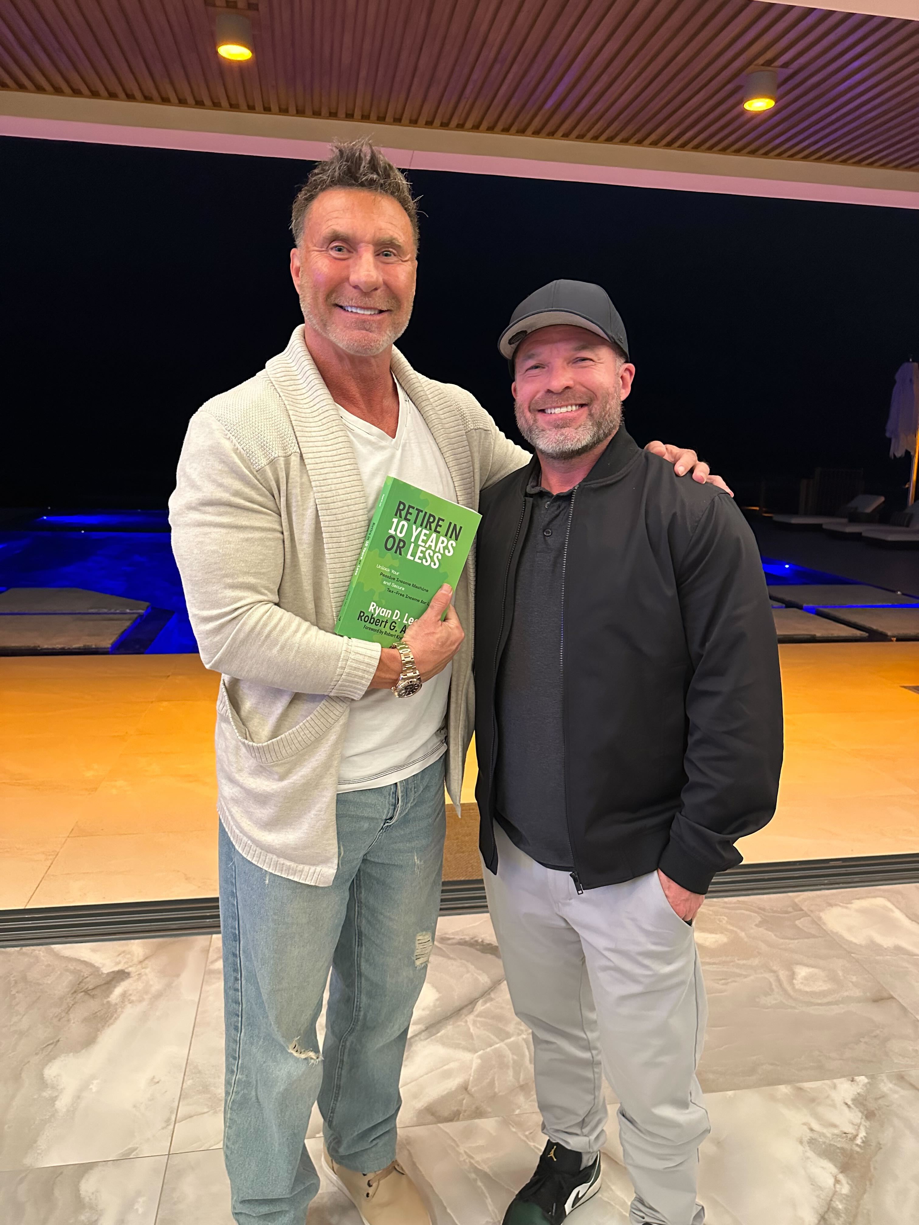 Authors with the book at an evening event