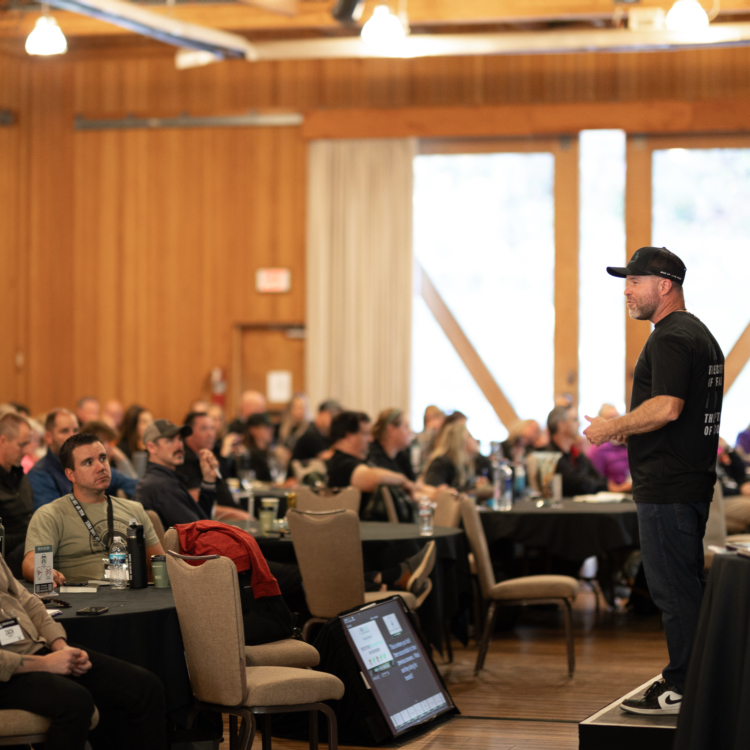 Speaker presenting to a full room