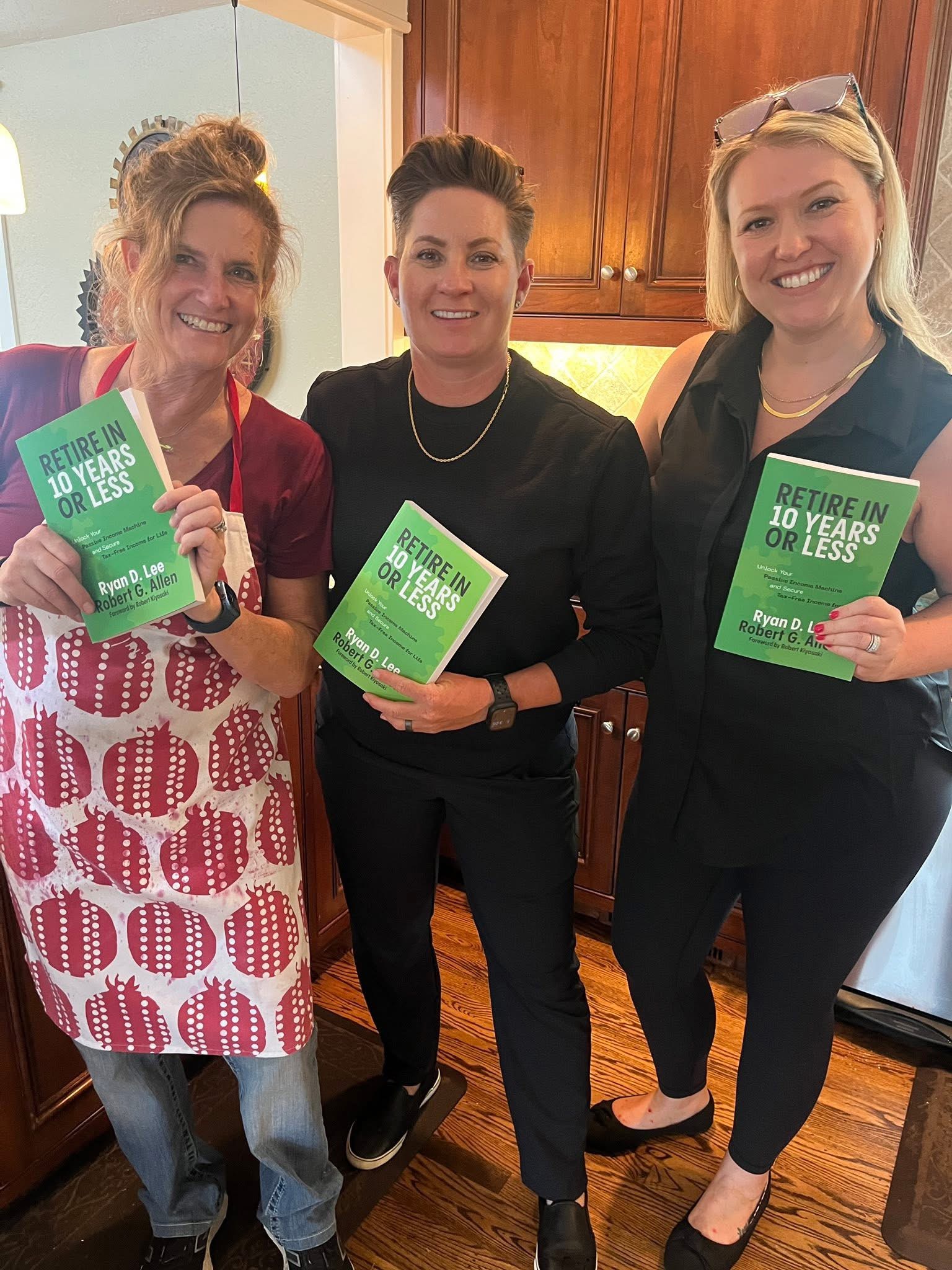 Readers holding copies of the book